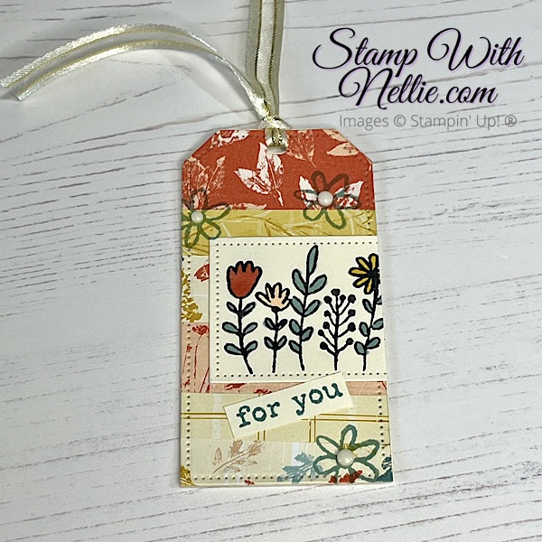 multi coloured gift tag decorated with strips of Inked Botanicals designer series paper and some stamping