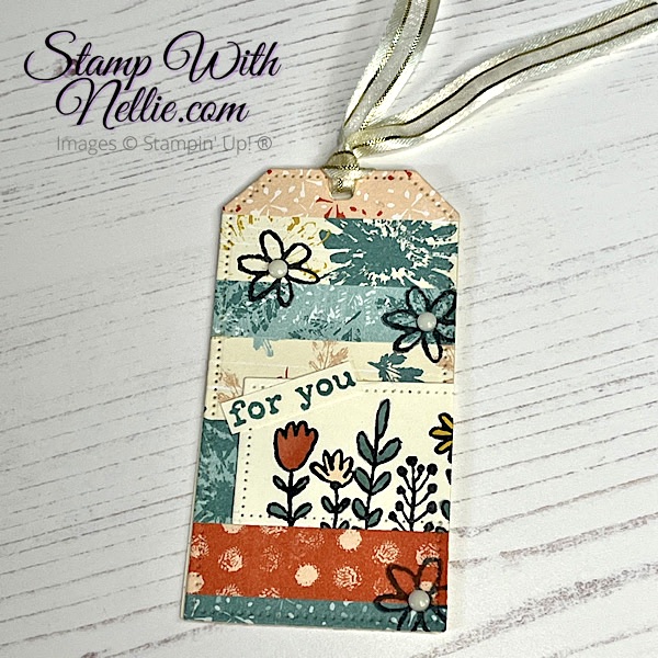 multi coloured gift tag decorated with strips of Inked Botanicals designer series paper and some stamping