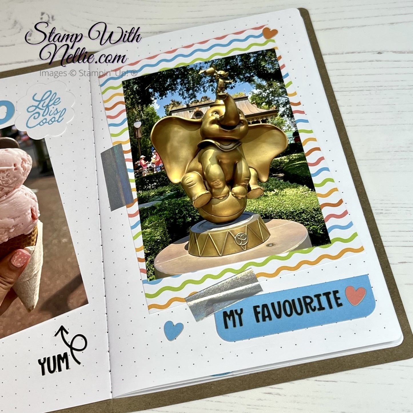 Photo of a statue of Dumbo in the Magic Kingdom that is glinting in the sun, stuck into my Love This Memory Notebook.