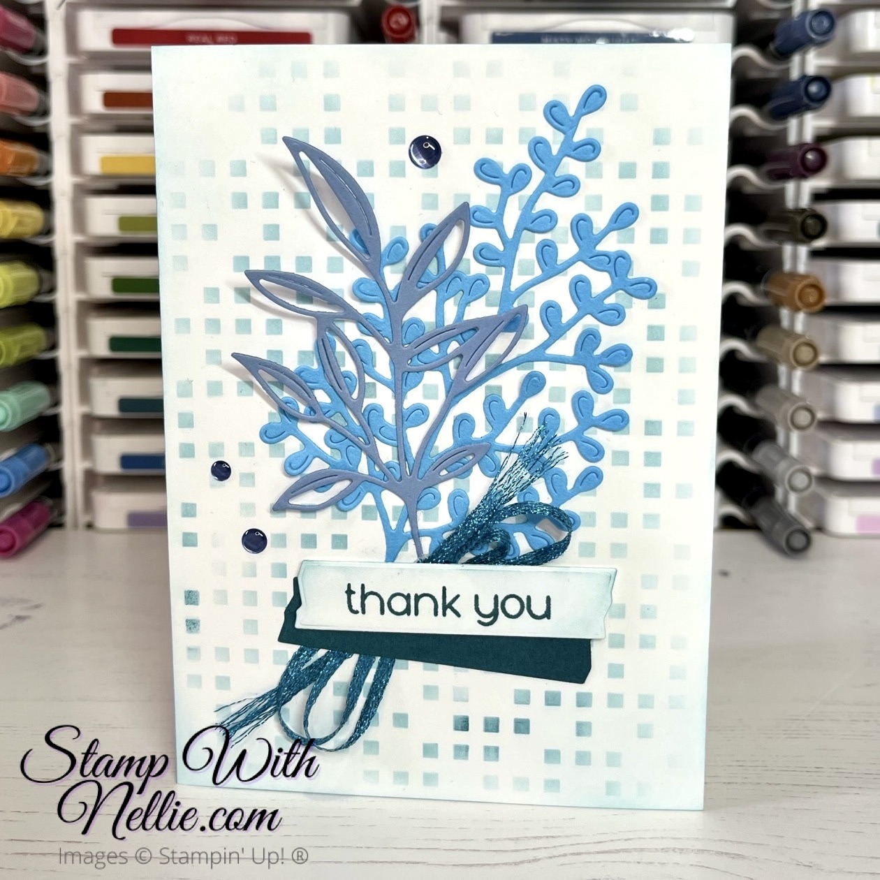 thank you card with 2 large blue die cut leaves, some ribbon and a thank you sentiment