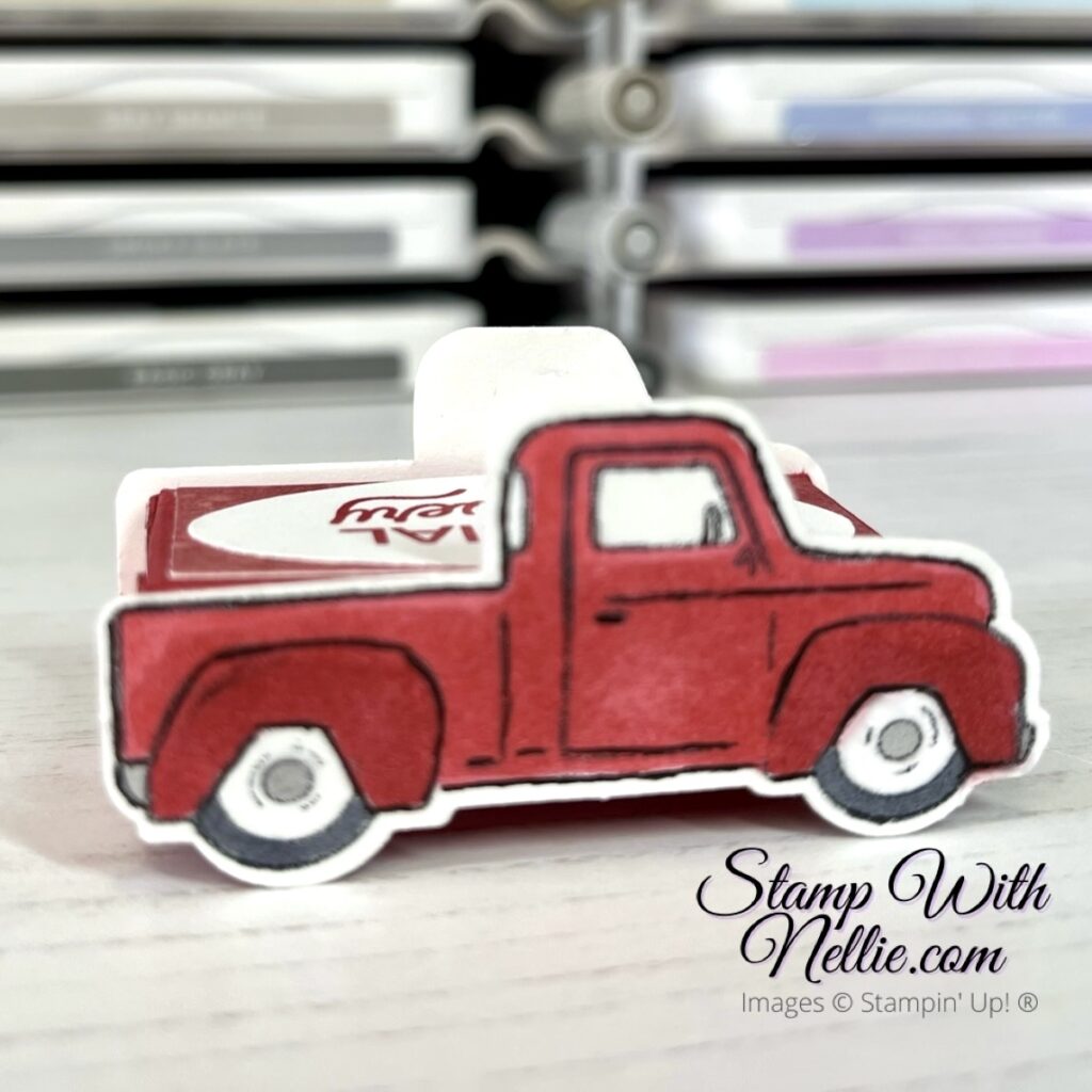 Photo of the right side of a little red truck treat box