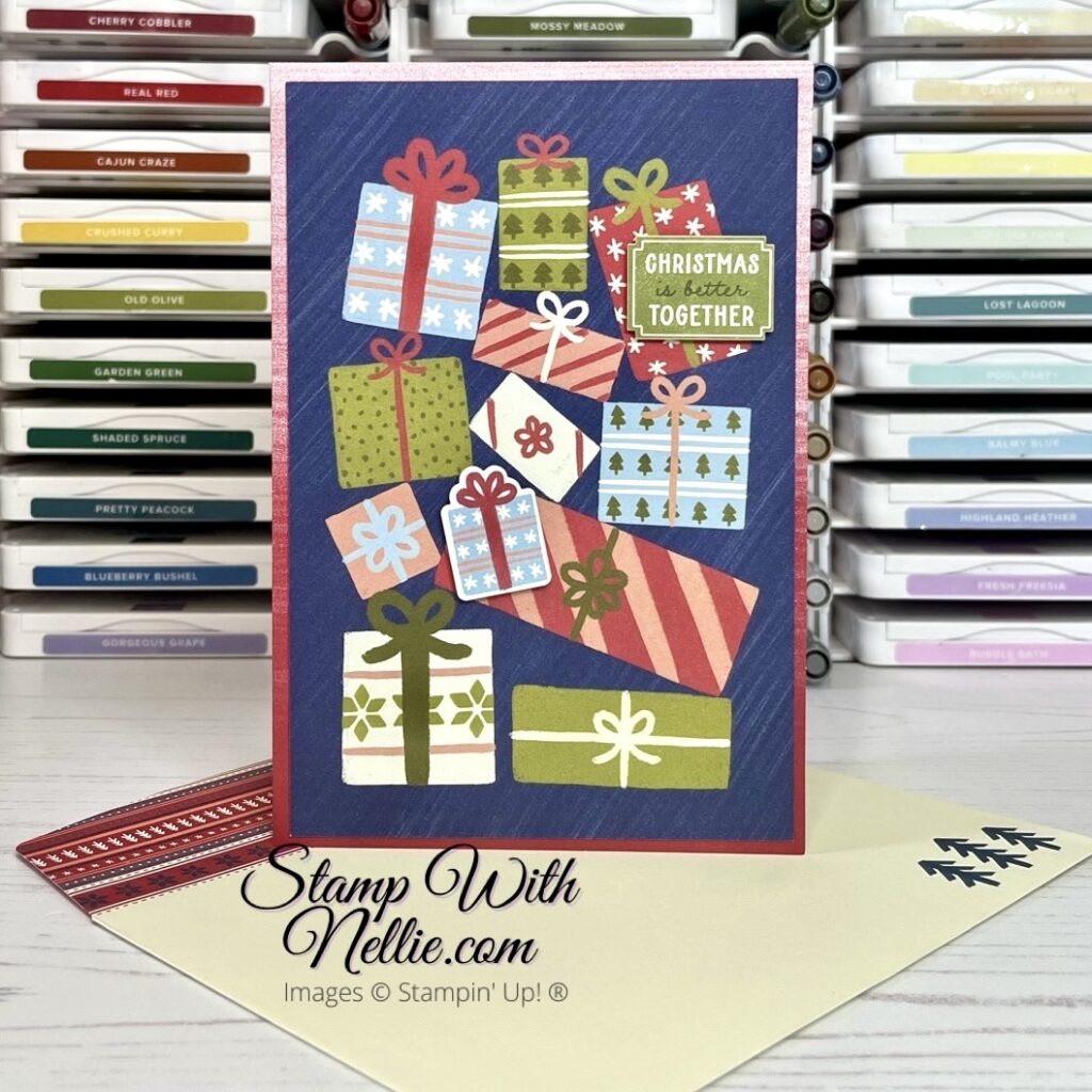 Christmas card with lots of bright coloured gifts on a blue background