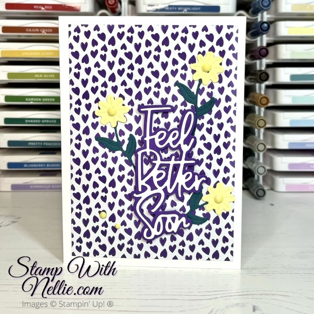 Feel Better Soon card with purple hearts on a white background. There are yellow flowers and green leaves too.