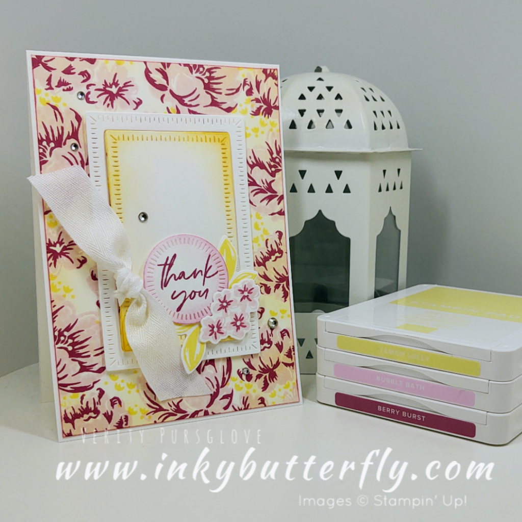 Photo of a very pretty thank you card with light and dark pink flowers in the background, with touches of yellow.